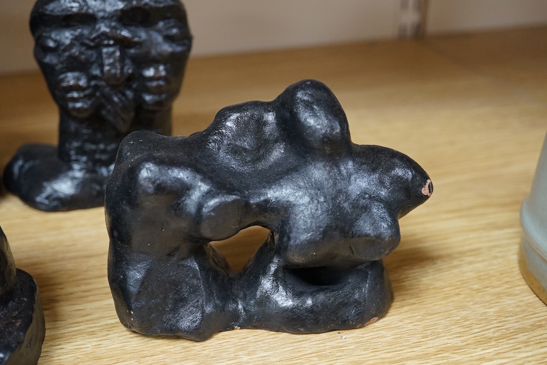 Three pairs of small black figural abstract sculptures, together with two similar sculptures. (8). Tallest 15cm high